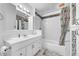 Clean bathroom, featuring a bathtub, shower, and vanity with a white cabinet at 1550 S Telluride St, Aurora, CO 80017