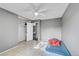 Bright bedroom featuring a large closet and tile flooring at 1550 S Telluride St, Aurora, CO 80017