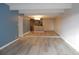 Open living room with hardwood floors and kitchen island at 8060 E Girard Ave # 601, Denver, CO 80231