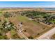 Aerial view of a ranch house on a large lot with outbuildings at 1637 S Us Highway 287, Berthoud, CO 80513
