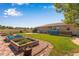 Landscaped backyard with garden beds and patio area at 1637 S Us Highway 287, Berthoud, CO 80513