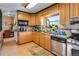 Kitchen with wood cabinets and appliances at 1637 S Us Highway 287, Berthoud, CO 80513