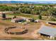 Aerial view showing home, land, and circular arena at 1637 S Us Highway 287, Berthoud, CO 80513