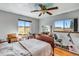 Comfortable main bedroom with large windows, a full-size bed, and an exercise bike at 1637 S Us Highway 287, Berthoud, CO 80513