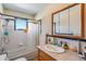 Clean bathroom with a tub, shower, and updated vanity with mirror at 1637 S Us Highway 287, Berthoud, CO 80513