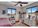 Charming bedroom with a twin bed, white dresser and plenty of natural light at 1637 S Us Highway 287, Berthoud, CO 80513