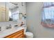 Simple bathroom with a toilet, sink, and built-in medicine cabinet at 1637 S Us Highway 287, Berthoud, CO 80513