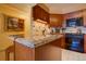 Kitchen detail showcasing granite countertops and rich wood cabinetry at 1625 Larimer St # 904, Denver, CO 80202