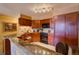 Well-equipped kitchen with granite countertops and dark wood cabinetry at 1625 Larimer St # 904, Denver, CO 80202