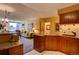 Open concept kitchen with breakfast bar, living area view, and modern finishes at 1625 Larimer St # 904, Denver, CO 80202