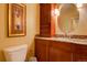 Guest Bathroom with granite countertop and wood cabinets at 1625 Larimer St # 904, Denver, CO 80202