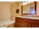 Bathroom with granite countertop and tiled shower at 1625 Larimer St # 904, Denver, CO 80202