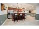 Finished basement bar with seating and mini-refrigerator at 5033 Silver Feather Way, Broomfield, CO 80023