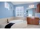 Spa-like bathroom with a large soaking tub and a double vanity at 5033 Silver Feather Way, Broomfield, CO 80023