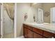 Clean bathroom with granite countertop and shower at 5033 Silver Feather Way, Broomfield, CO 80023