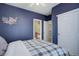 Comfortable bedroom with a queen bed and ensuite bathroom access at 5033 Silver Feather Way, Broomfield, CO 80023