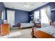 Bright bedroom featuring two twin beds and ample natural light at 5033 Silver Feather Way, Broomfield, CO 80023