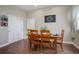 Cozy breakfast nook with a wood table and four chairs, adjacent to a kitchen at 5033 Silver Feather Way, Broomfield, CO 80023