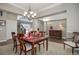 Bright dining room with a wooden table, six chairs, and a chandelier at 5033 Silver Feather Way, Broomfield, CO 80023