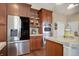 Kitchen boasts stainless steel appliances and granite countertops at 5033 Silver Feather Way, Broomfield, CO 80023