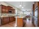 Open concept kitchen with island and stainless steel appliances at 5033 Silver Feather Way, Broomfield, CO 80023