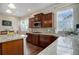 Modern kitchen with granite countertops and wood cabinets at 5033 Silver Feather Way, Broomfield, CO 80023