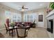 Bright living room with plantation shutters and leather furniture at 5033 Silver Feather Way, Broomfield, CO 80023