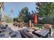 Spacious patio with seating area, fire pit, and umbrella at 5033 Silver Feather Way, Broomfield, CO 80023