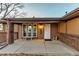 House front with covered entryway and landscaping at 6131 Xavier Ct, Arvada, CO 80003