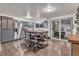 Modern kitchen with gray cabinets, stainless steel appliances, and an island at 6131 Xavier Ct, Arvada, CO 80003