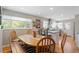 Open concept dining area with kitchen view, hardwood floors, and seating for six at 9560 W 38Th Ave, Wheat Ridge, CO 80033