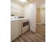 Laundry room with washer, dryer, and shelving at 8470 S Little Rock Way # 101, Highlands Ranch, CO 80126