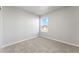 Spacious bedroom with neutral walls and carpeted floors at 2971 Pershing St, Strasburg, CO 80136