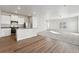 Modern kitchen with stainless steel appliances and island at 2971 Pershing St, Strasburg, CO 80136