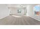 Bright and spacious living room with carpeted floors at 2971 Pershing St, Strasburg, CO 80136