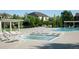 Community pool and kiddie pool area with surrounding lounge chairs at 3230 Boulder Cir # 101, Broomfield, CO 80023
