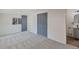 Spacious bedroom with grey carpet and built-in closet at 3401 W Virginia Ave, Denver, CO 80219