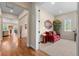 Hallway with hardwood floors and access to a sitting room at 15003 W 63Rd Ave, Arvada, CO 80403