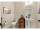 Convenient powder room with pedestal sink and toilet at 15003 W 63Rd Ave, Arvada, CO 80403