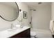 Modern bathroom with a bathtub, shower, and floating vanity at 436 Devinney Ct, Golden, CO 80401