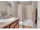 Clean bathroom with tub, shower, and granite countertop at 11865 Barrentine Loop, Parker, CO 80138