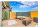 Private backyard patio features a seating area and lush artificial turf at 11865 Barrentine Loop, Parker, CO 80138