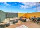 Spacious backyard patio with seating area, artificial turf, and wood privacy wall at 11865 Barrentine Loop, Parker, CO 80138