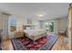 Main bedroom with hardwood floors, sliding doors to patio and ensuite bath at 9362 Tollgate Dr, Longmont, CO 80503