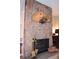 Stone fireplace with brass fireplace tools, creating a cozy ambiance at 2815 S Locust St # F, Denver, CO 80222