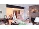 Bright living room with stone fireplace, built-in shelving, and comfortable seating at 2815 S Locust St # F, Denver, CO 80222