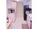Functional kitchen with light wood cabinets, ample counter space, and modern appliances at 2815 S Locust St # F, Denver, CO 80222