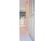 Bright laundry room with washer, dryer, and storage shelves at 2815 S Locust St # F, Denver, CO 80222