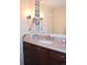 Bathroom featuring a vanity with granite countertop and updated fixtures at 2815 S Locust St # F, Denver, CO 80222