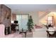 Spacious living room featuring a stone fireplace and ample natural light at 2815 S Locust St # F, Denver, CO 80222